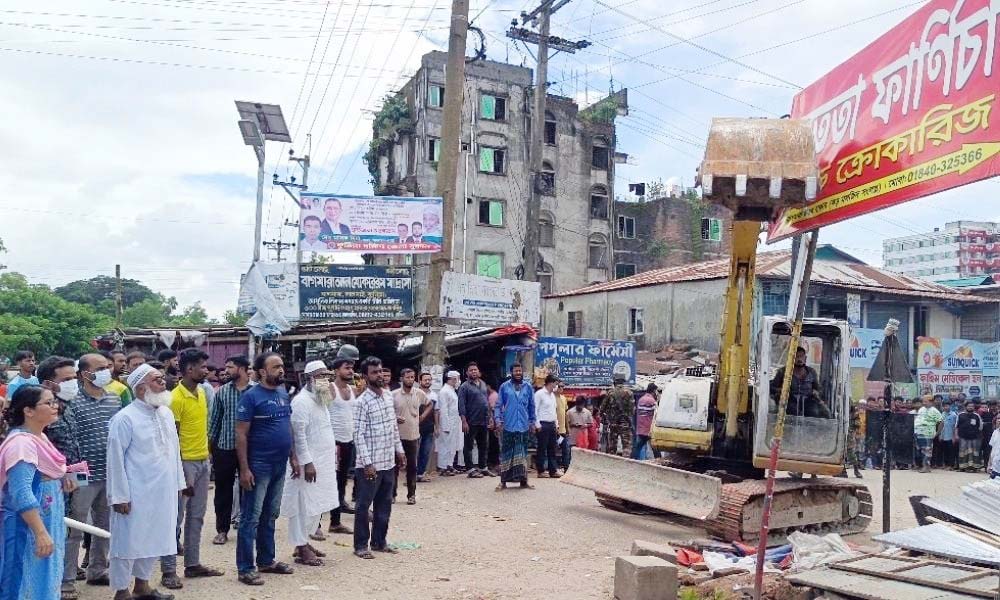 লালমাই উপজেলার বাগমারা বাজারে শতাধিক অবৈধ স্থাপনা উচ্ছেদ লালমাই উপজেলার বাগমারা বাজারে শতাধিক অবৈধ স্থাপনা উচ্ছেদ